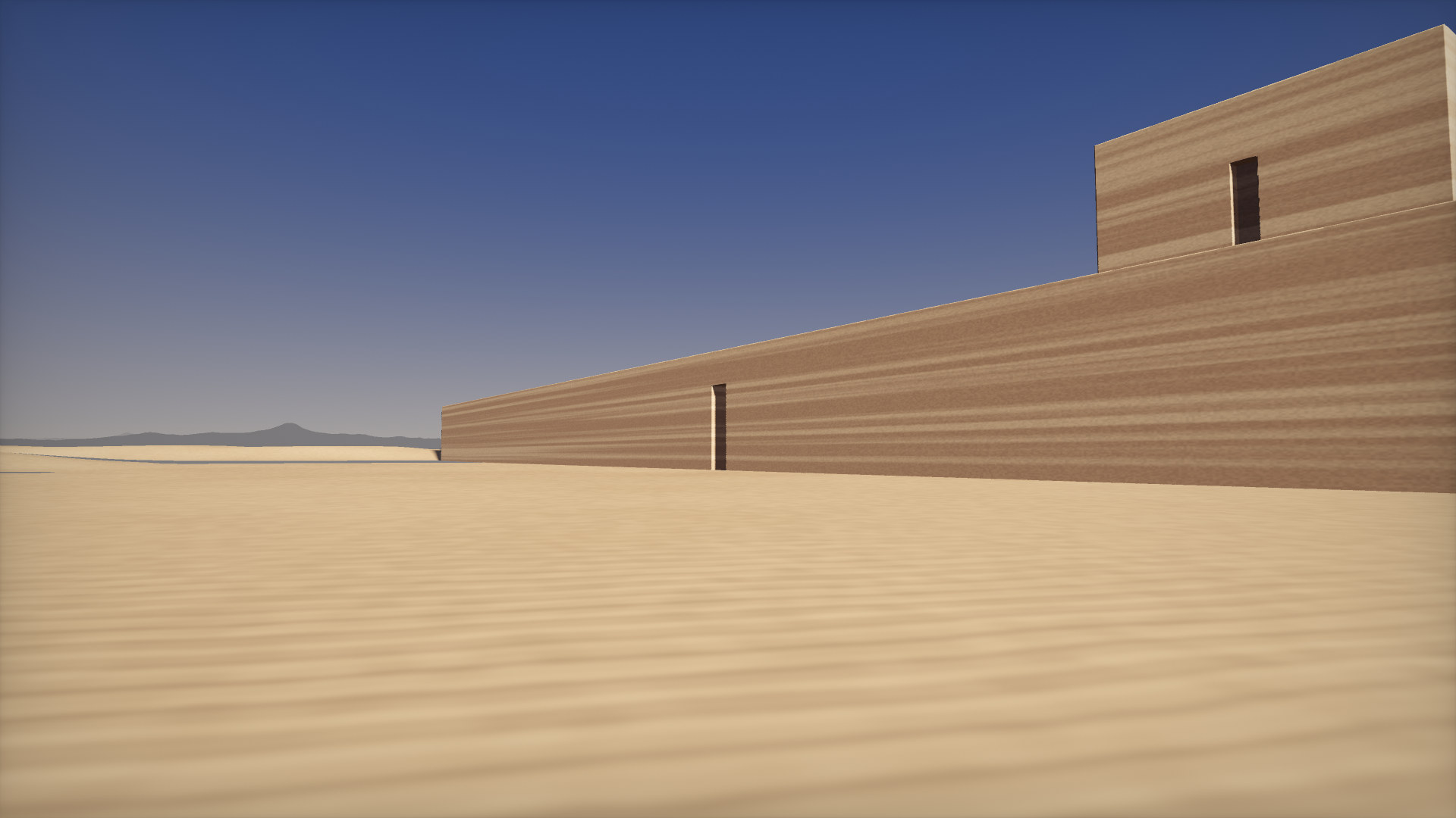 A ten-metre wall of rammed earth crossing the desert, a tall narrow door cut through it, a block tower behind.